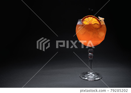 fresh orange aperol spritz mango cocktail with ice in glass on black background fresh orange aperol spritz mango cocktail with ice in glass on black background 79285202