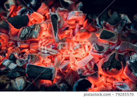 Burning coals. Decaying charcoal. Texture embers closeup. burning charcoal in the background. burning coals of a fire.Smoldering ashes. BBQ barbecue. Night light. Decaying charcoal, barbeque season. Burning coals. Decaying charcoal. Texture embers closeup. burning charcoal in the background. burning coals of a fire.Smoldering ashes. BBQ barbecue. Night light. Decaying charcoal, barbeque season. 79285570