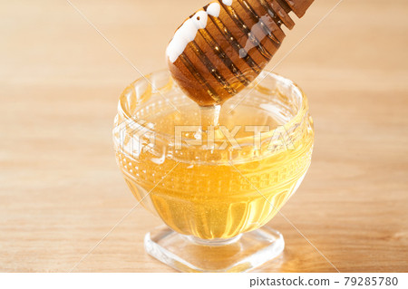 Honey and honey dipper Honey and honey dipper 79285780