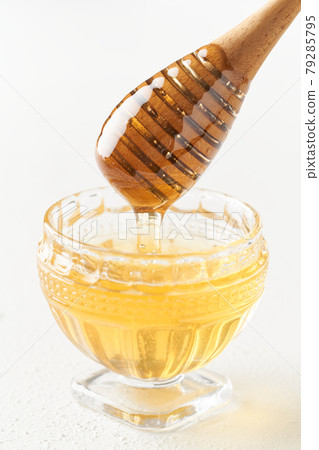 Honey and honey dipper 79285795