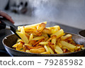Cooking fried potatoes in a frying pan 79285982