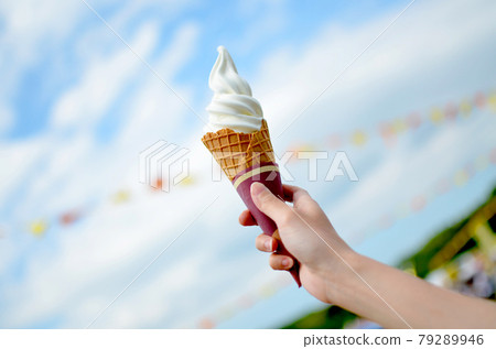 Soft serve ice cream, blue sky and flags 79289946