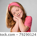 Portrait of cute daydreaming redhead kid girl in 79290124