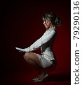 Young gorgeous slim blonde curly woman in long 79290136