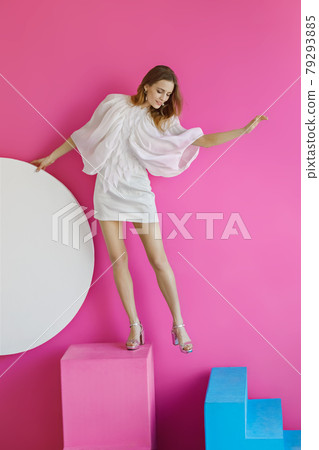 Pretty young girl on pink background Pretty young girl on pink background 79293885