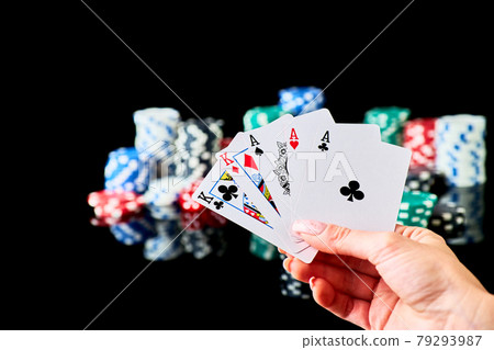 Casino chips, playing cards and dices on dark reflective background Casino chips, playing cards and dices on dark reflective background 79293987