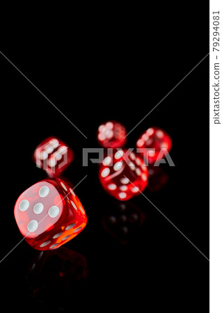 red and white craps or dices on reflective black background 79294081