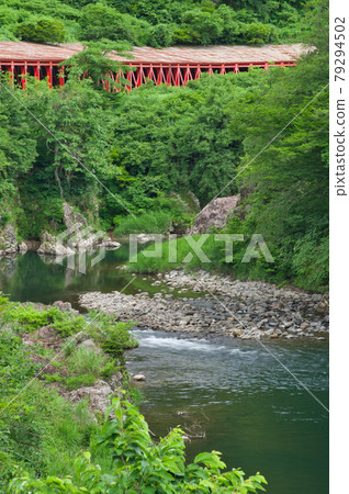 Red Snow Shed and Aburuma River in Uonuma City, Niigata Prefecture 79294502