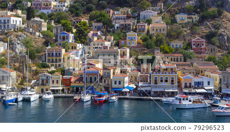 Greece. Dodecanese. Islands Symi.Colorful houses and boats and yachts . Greece. Dodecanese. Islands Symi.Colorful houses and boats and yachts . 79296523