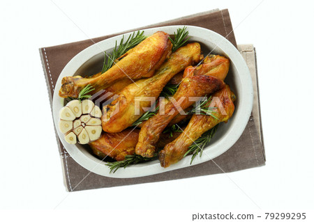 Tray of roast chicken drumsticks isolated on white background Tray of roast chicken drumsticks isolated on white background 79299295