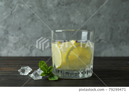 Glass of lemonade on wooden table, close up 79299471