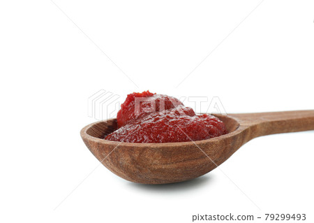 Spoon with tomato paste isolated on white background 79299493