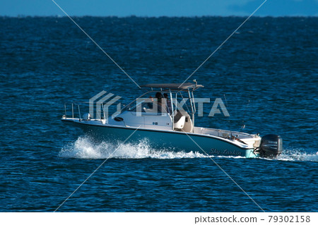 A fishing boat floating in Ise Bay from Marina Kawage A fishing boat floating in Ise Bay from Marina Kawage 79302158