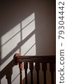 Light coming in through the window and its shadow 79304442