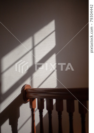 Light coming in through the window and its shadow 79304442