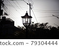 A black-and-white photo of a fashionable streetlight overlaid on the sun 79304444
