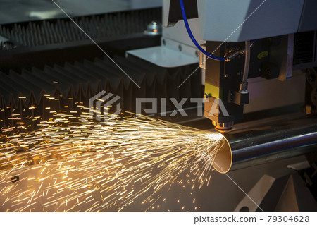The fiber laser cutting machine cutting the stainless steel tube control by CNC program. 79304628