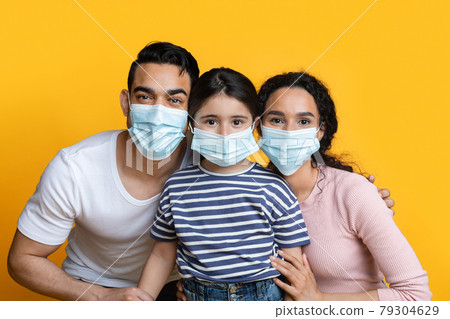 Portrait Of Happy Arab Family With Little Daughter Wearing Protective Medical Masks Portrait Of Happy Arab Family With Little Daughter Wearing Protective Medical Masks 79304629