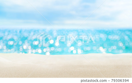 Seascape and sandy beach. Defocused sea water surface glittering on the sun. 79306394