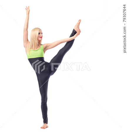 Attractive female gymnast exercising at studio 79307644