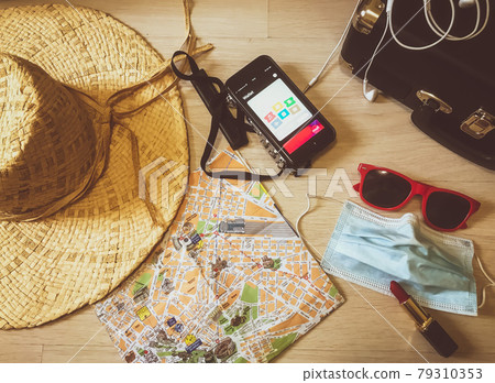 Travelling things which can be useful at any trip: camera, map, mask, hat 79310353