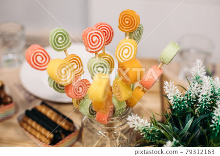 Delicious marmelade on sticks. Delicious marmelade on sticks. 79312163