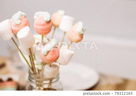 Sweets, vanilla marshmallows and lollipops on Sweets, vanilla marshmallows and lollipops on 79312165