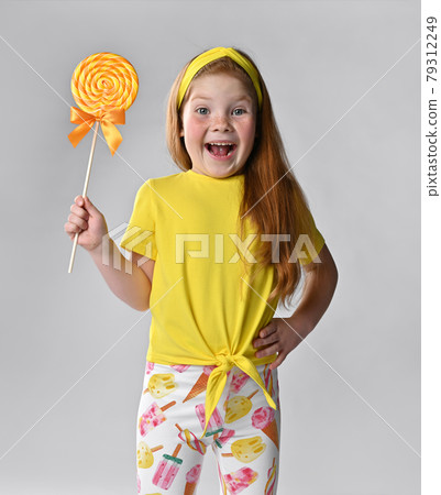 Crazy screaming happy little red-haired girl child 79312249