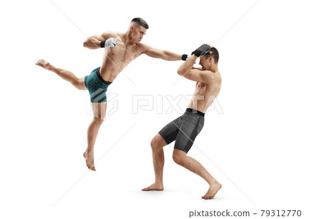Punch in MMA. Two fighters are fighting. Hand kick. Sport action concept. Isolated Punch in MMA. Two fighters are fighting. Hand kick. Sport action concept. Isolated 79312770