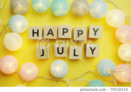 Happy July alphabet letter with LED Cotton ball Decoration on yellow background 79316554