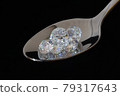 Jewels on a spoon 79317643