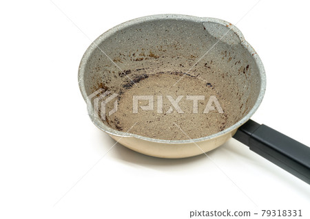 Small modern saucepan with burning mark on the surface, modern pan with black handle, 45-degree angle view, the image on white background. 79318331
