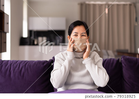 Senior asian woman wearing masks protect coronavirus or covid-19 at home,Coronavirus protection 79318925