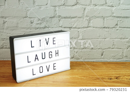 Live Laugh Love word in light box 79320231