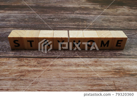 Stay Home alphabet letter on wooden background 79320360