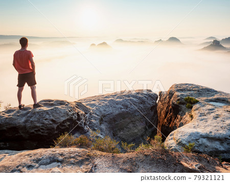 Self confident man tourist  standing with hands in pocket of black pant Self confident man tourist  standing with hands in pocket of black pant 79321121
