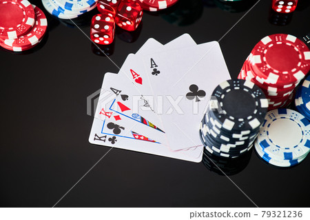 Casino chips, playing cards and dices on dark reflective background 79321236