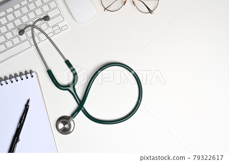 Stethoscope, notebook and glasses on white background. Stethoscope, notebook and glasses on white background. 79322617