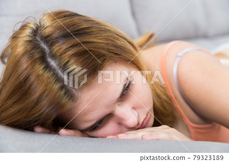 Gloomy teenager girl depression at home Gloomy teenager girl depression at home 79323189