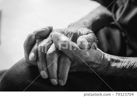 Hands of an old man on the wood table .vintage tone Hands of an old man on the wood table .vintage tone 79323704