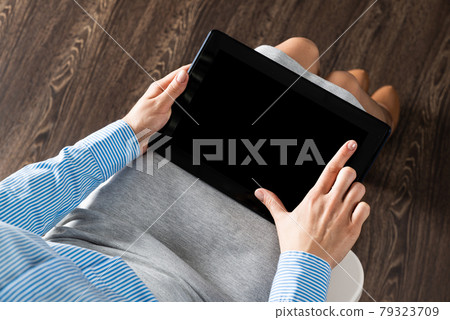 business woman with tablet on her lap business woman with tablet on her lap 79323709