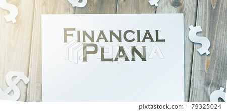 financial plan words on page and paper signs of dollar around. Business concept 79325024