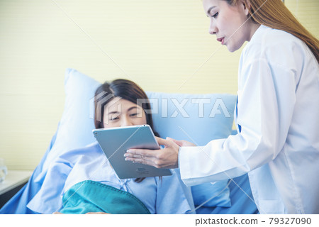 Woman doctor and patient consultation with professional specialist diagnostics at hospital medicare treatment clinic. Doctor writing prescription for medical health care therapy. Woman doctor and patient consultation with professional specialist diagnostics at hospital medicare treatment clinic. Doctor writing prescription for medical health care therapy. 79327090