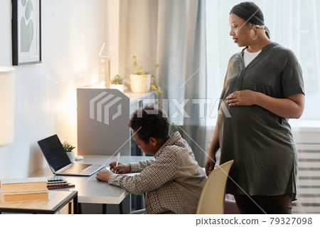 Mother Helping Boy doing Homework Mother Helping Boy doing Homework 79327098
