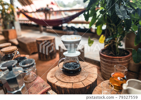 Pouring a hot water over a drip coffee 79327559