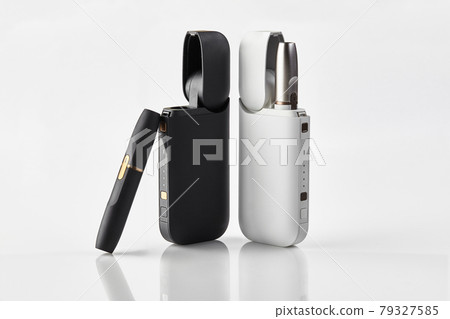 New generation black and white electronic cigarettes and open batteries isolated on white. Hi-tech heating tobacco system. Advertising, close up 79327585