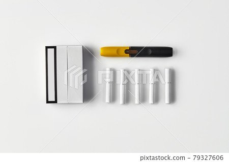 New generation black and yellow electronic cigarette, one pack and five heatsticks isolated on white. New technology. Heating tobacco system. Close up 79327606