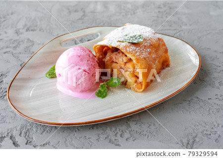 Piece of apple pie served with ice cream Piece of apple pie served with ice cream 79329594