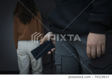 criminal taking illegal photos, video of person from back 79329657