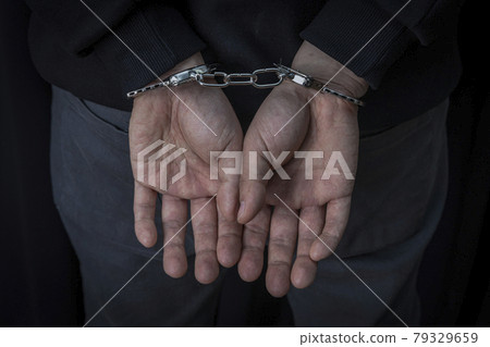 criminal and handcuffs 79329659